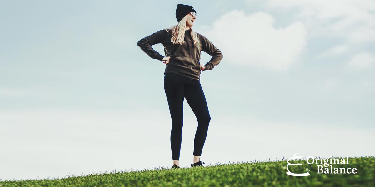 Original-Balance-Getting-the-Mental-Edge-photo-of-a-woman-on-top-of-a-hill