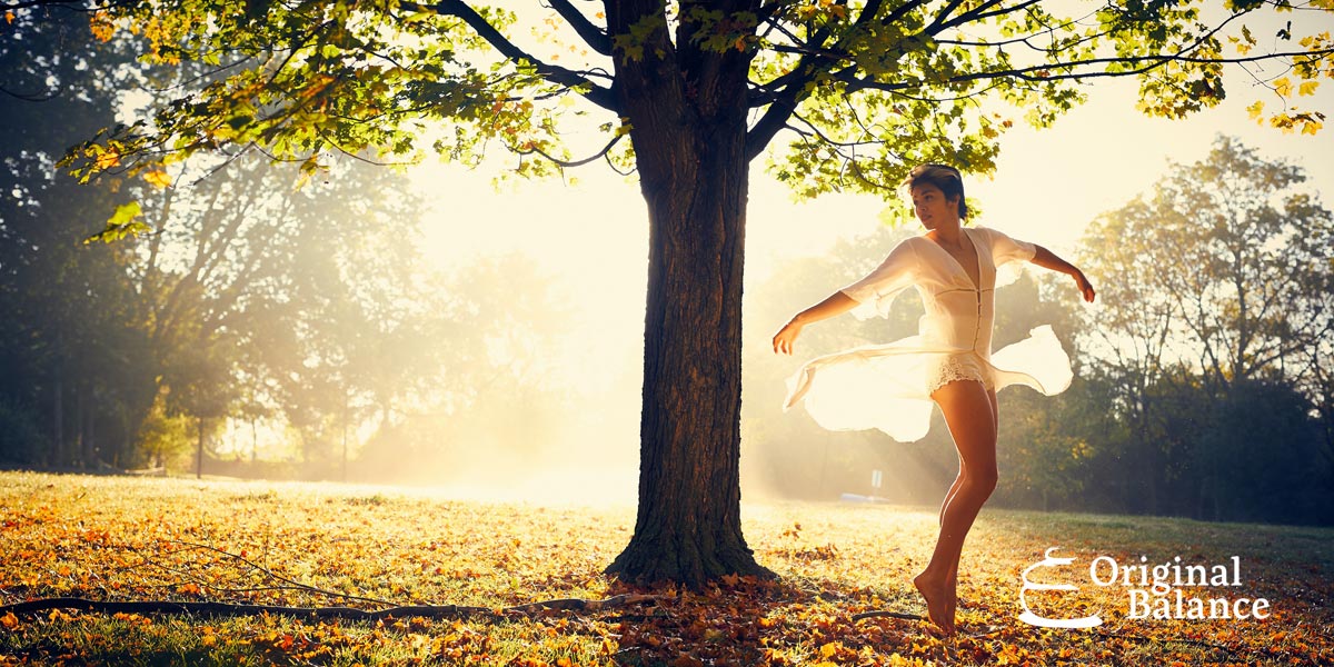 Original-Balance-Universal-Principles-Of-Success--photo-of-a-woman-balancing-her-self-in-the-park-near-a-tree
